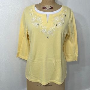 Yellow with daisies and butterflies knit top.
